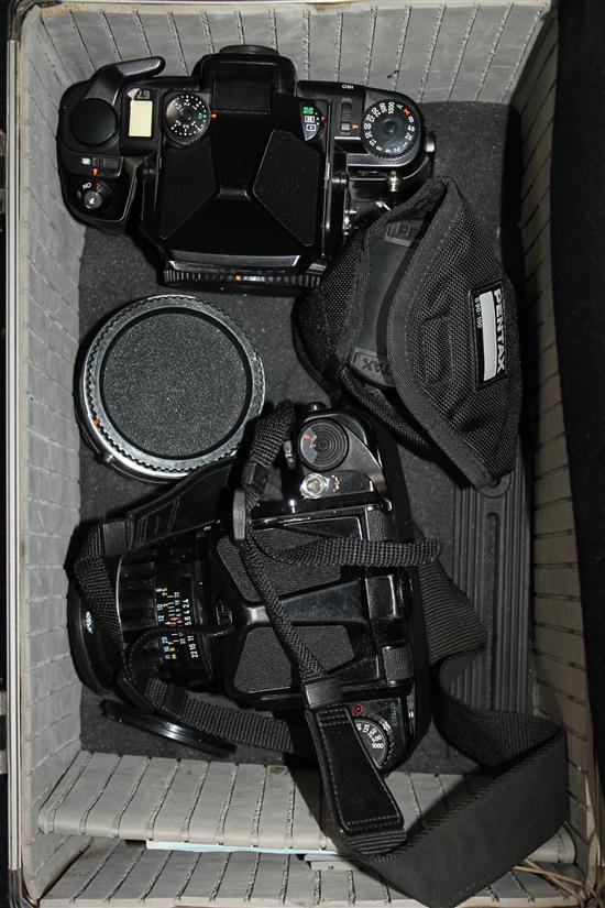 An Asahi Pentax 6 x 7 format camera and a Pentax 67 II camera and lenses,